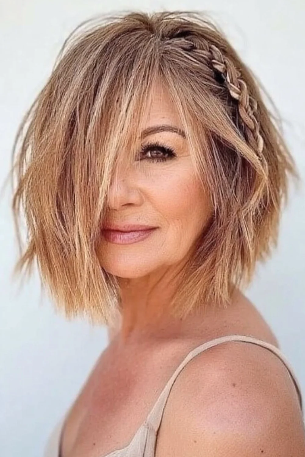 Lace braid added to a bob haircut for a delicate, stylish touch.