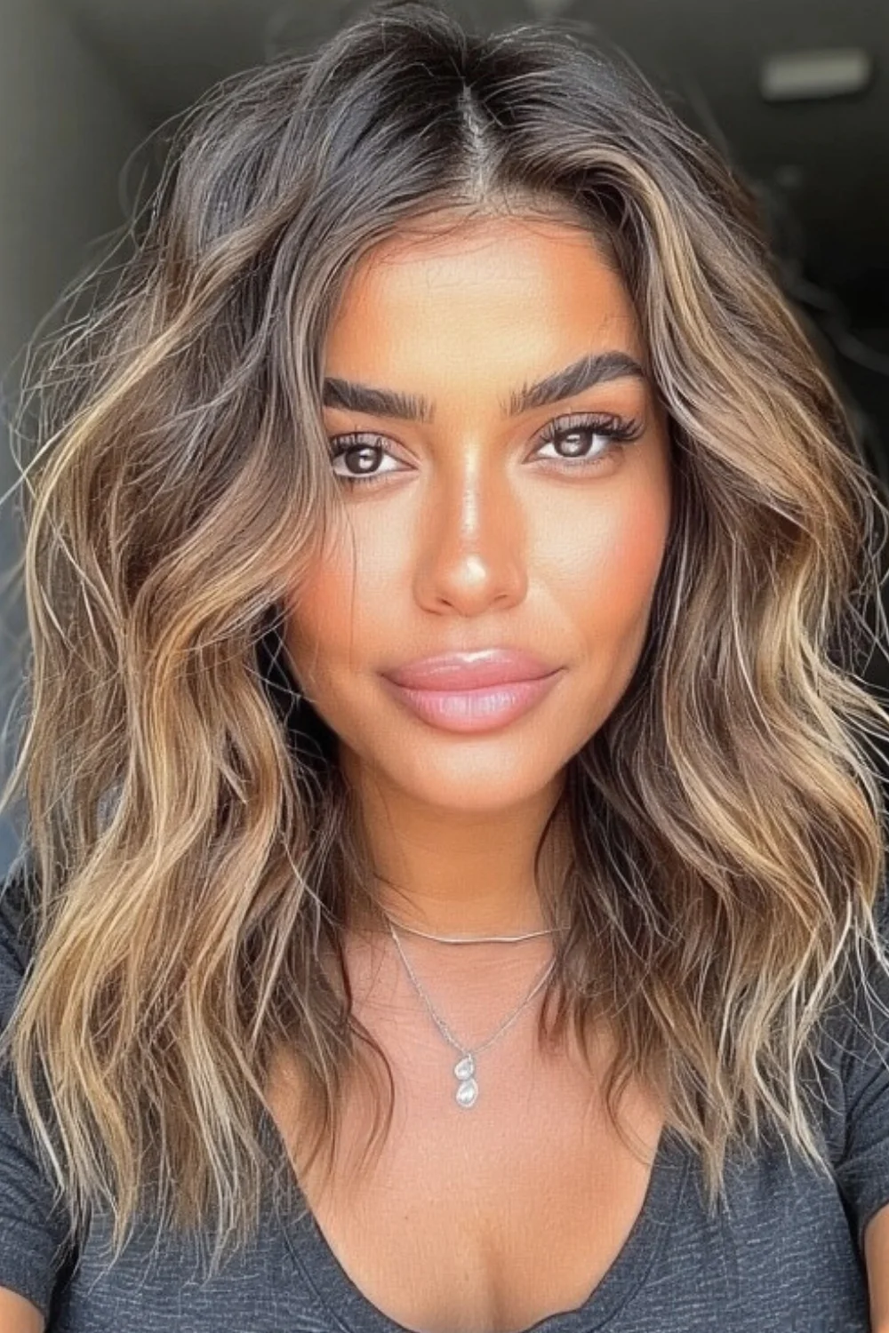 Messy shag-style lob with soft waves and layered ends for an effortlessly cool feel.