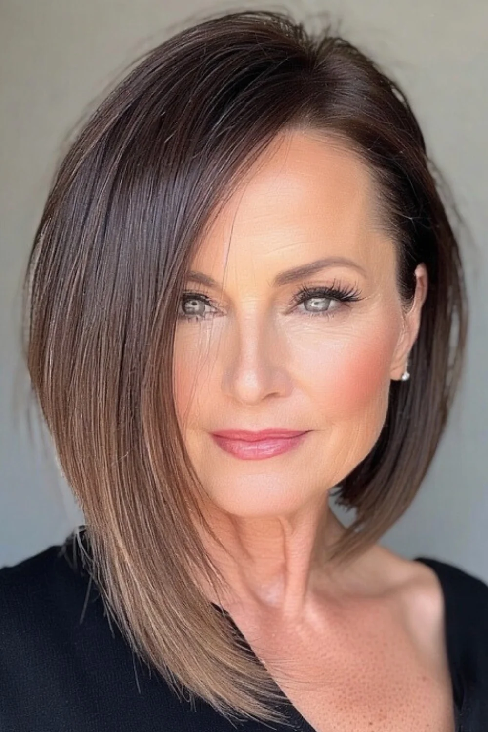 Modern asymmetrical haircut adding an edgy look.
